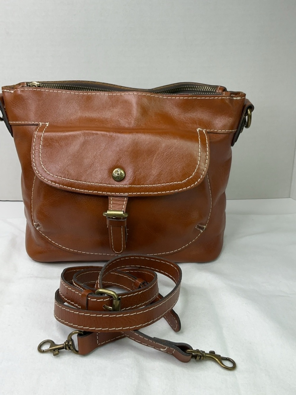 Patricia Nash tan leather crossbody bag.